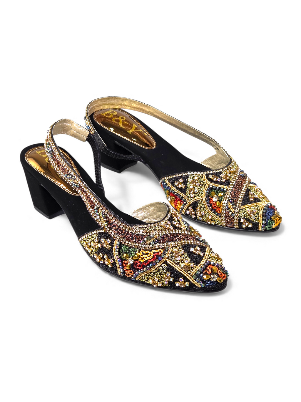 A pair of black high-heeled shoes with gold and colorful embellishments, including rhinestones and intricate designs.