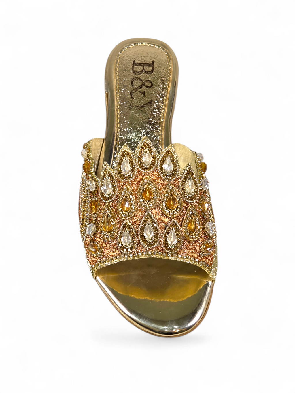 A gold and beige ornate sandal with a decorative beaded and crystal embellishment design.