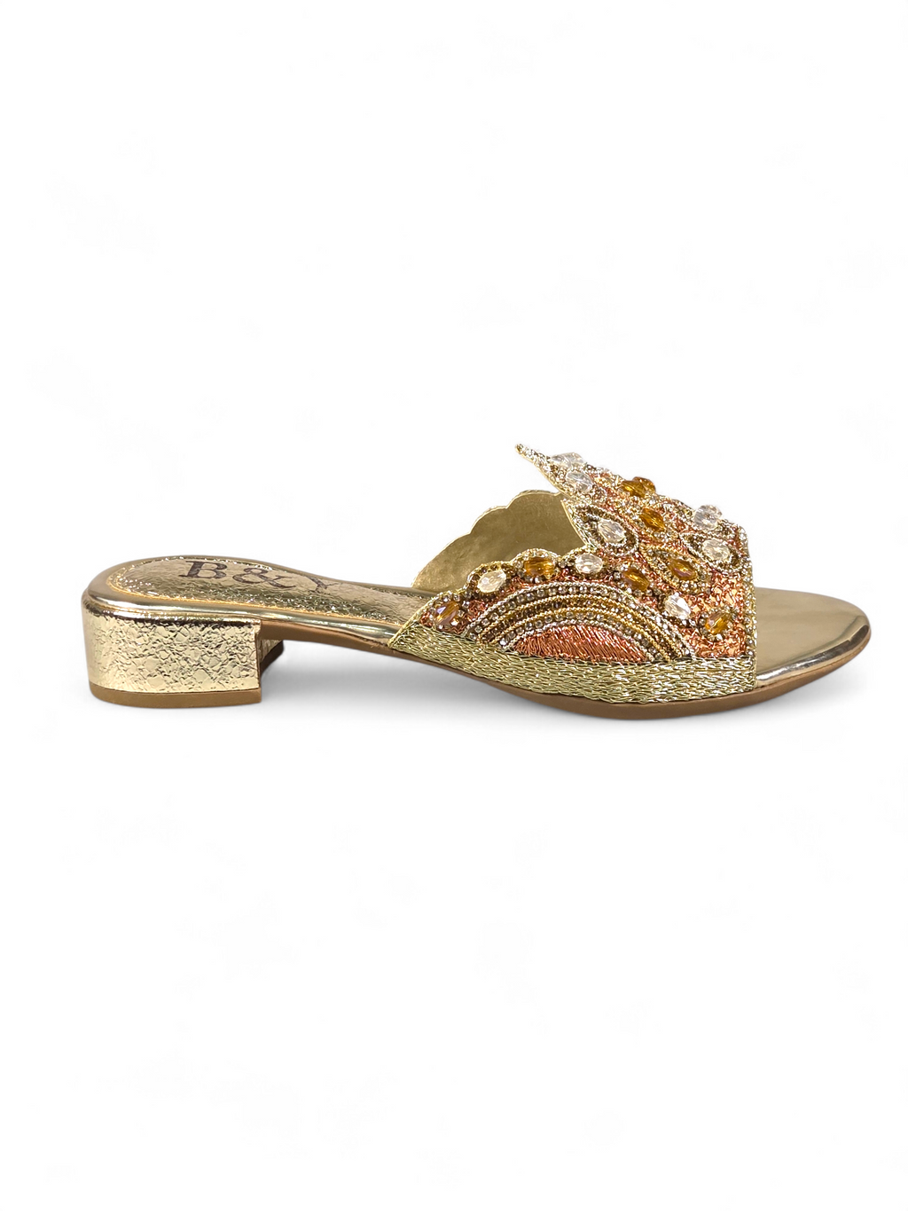 A gold-colored, embellished sandal with a decorative, embellished heel.