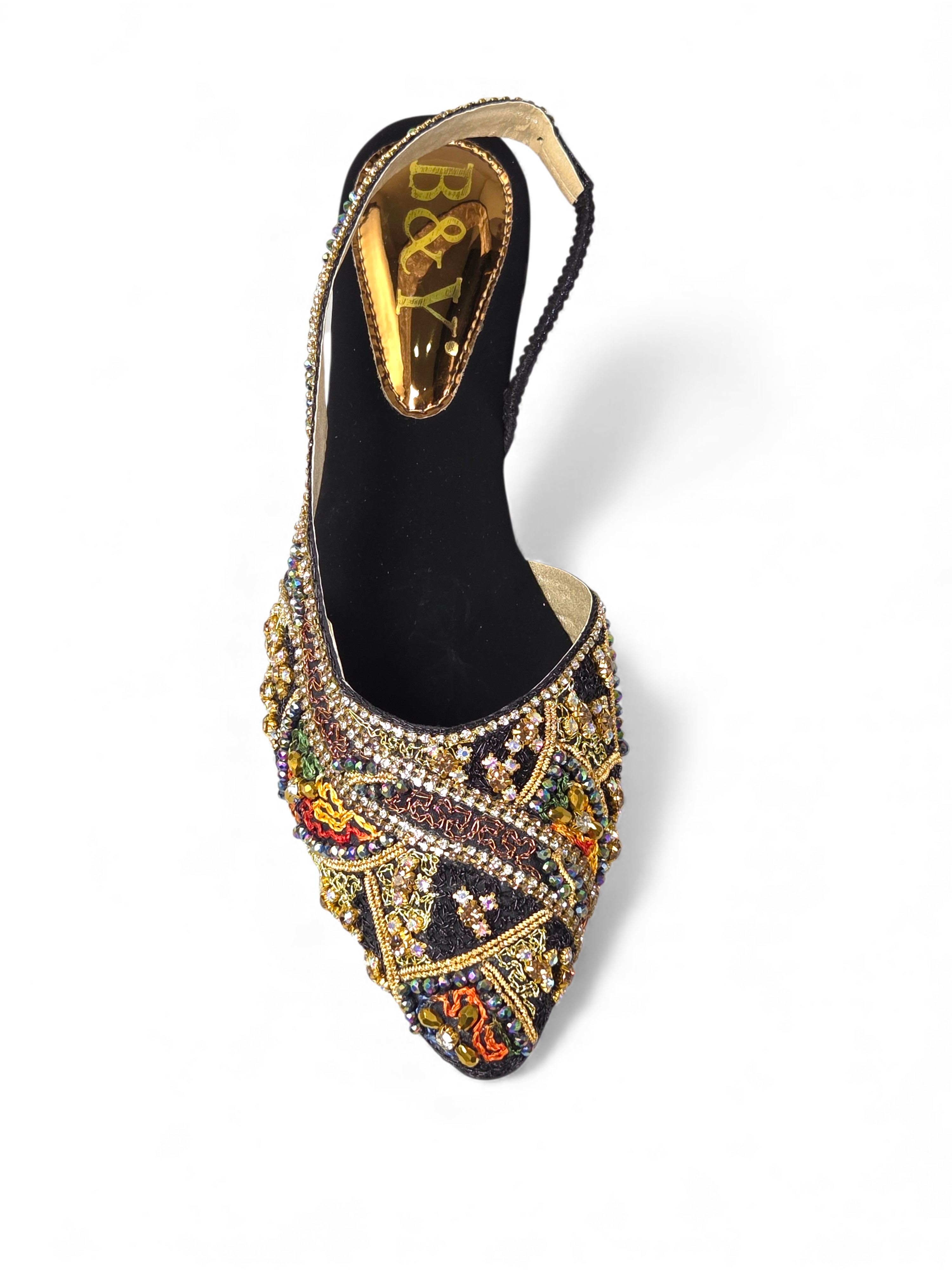 A black high-heeled shoe with a gold and colorful beaded design.