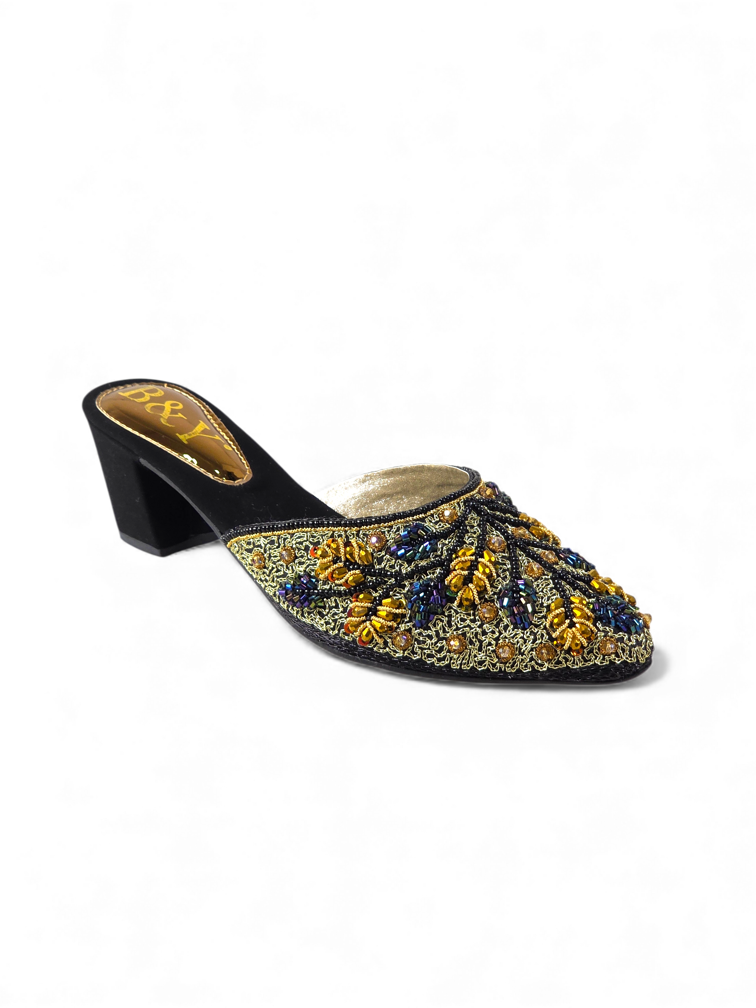 A black and gold embellished mens shoe with a pointed toe and a chunky heel.