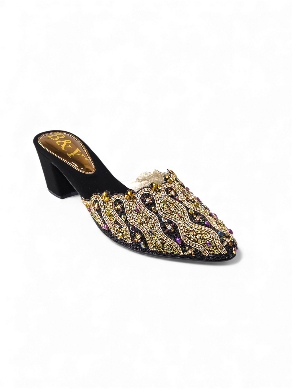 A black and gold embellished mens shoe with a pointed toe and a chunky heel.